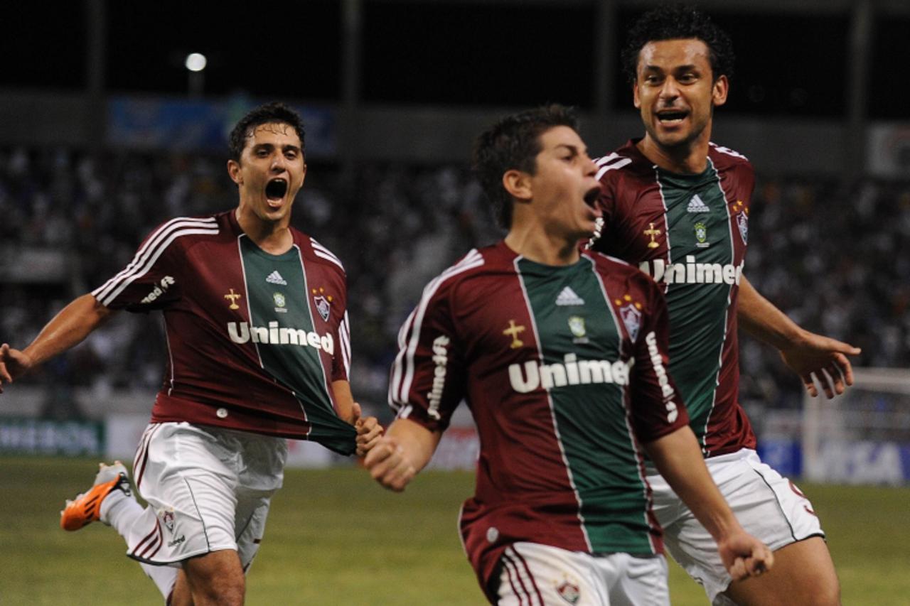 \'Brazil\'s Fluminense Dario Conca (C) celebrates with teammates Fred (L) and Marquinhos his goal against Paraguay\'s Libertad  Club during their Copa Libertadores  football match at Joao Havelange Ol