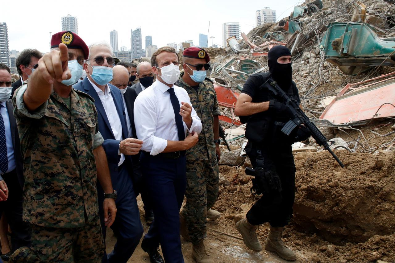 FILE PHOTO: French President Emmanuel Macron visits the devastated site of the explosion at the port of Beirut