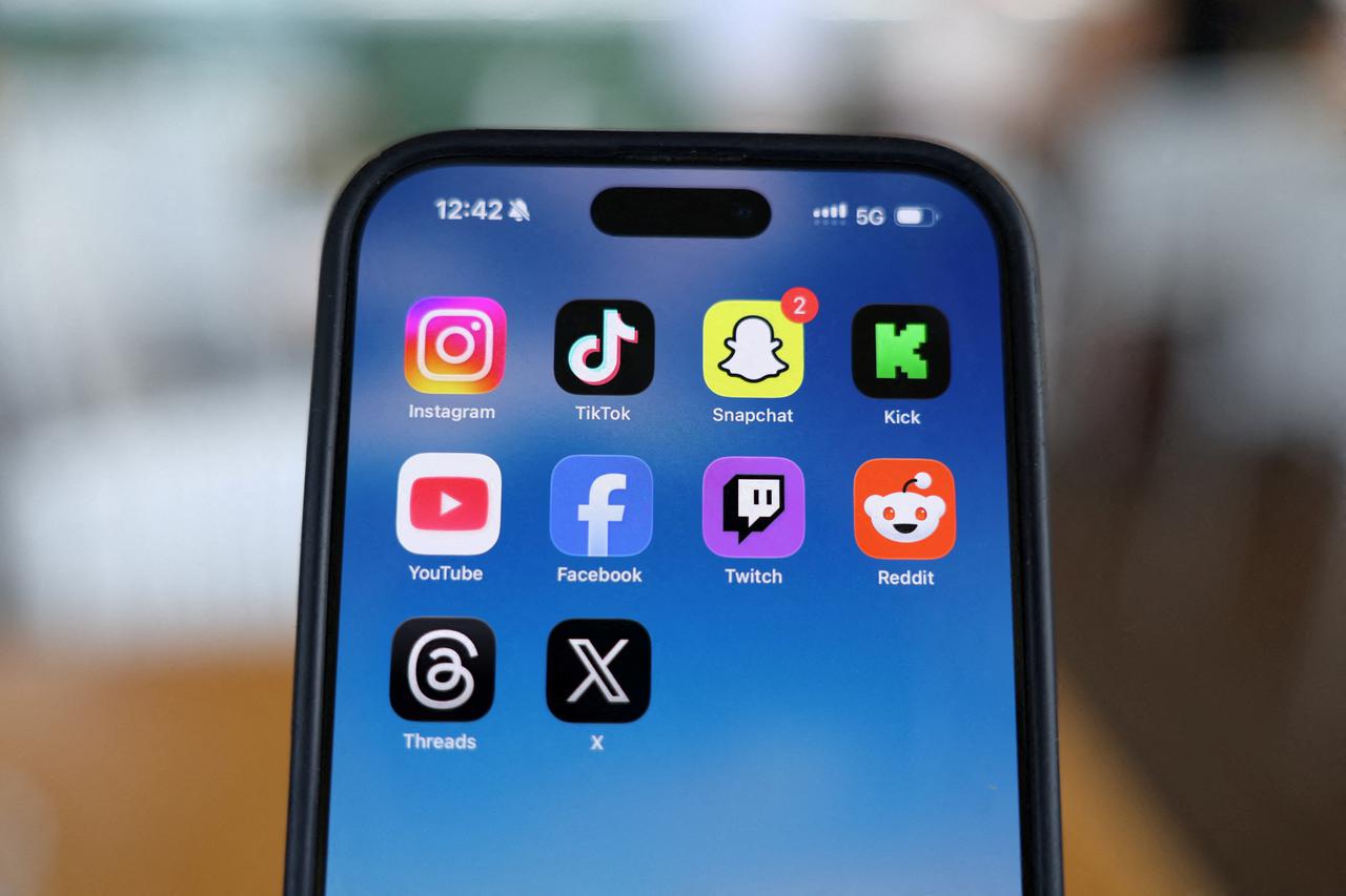 FILE PHOTO: Social media apps are displayed on a mobile phone