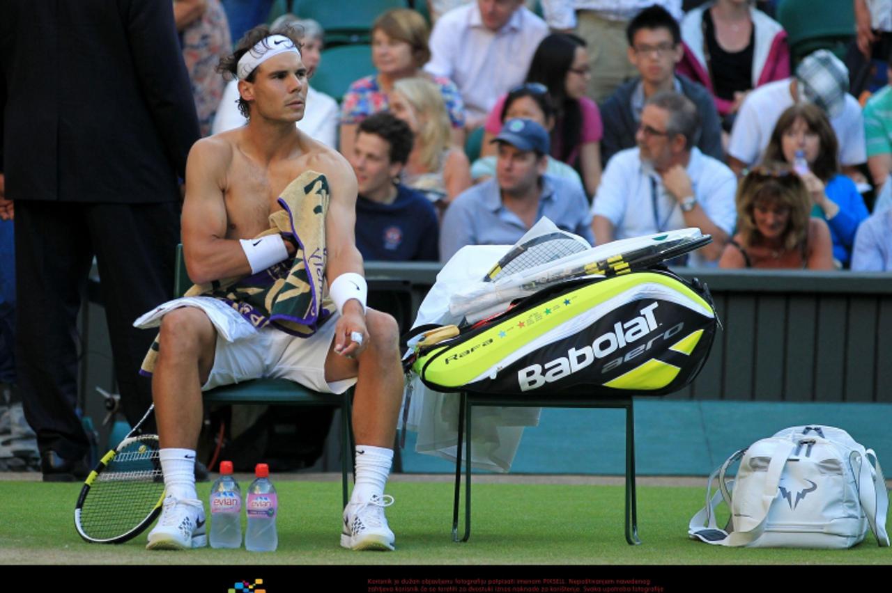 'Spain's Rafael Nadal during a break in his match against Czech Republic's Lukas Rosol during day four of the 2012 Wimbledon Championships at the All England Lawn Tennis Club, Wimbledon. Photo: Pres