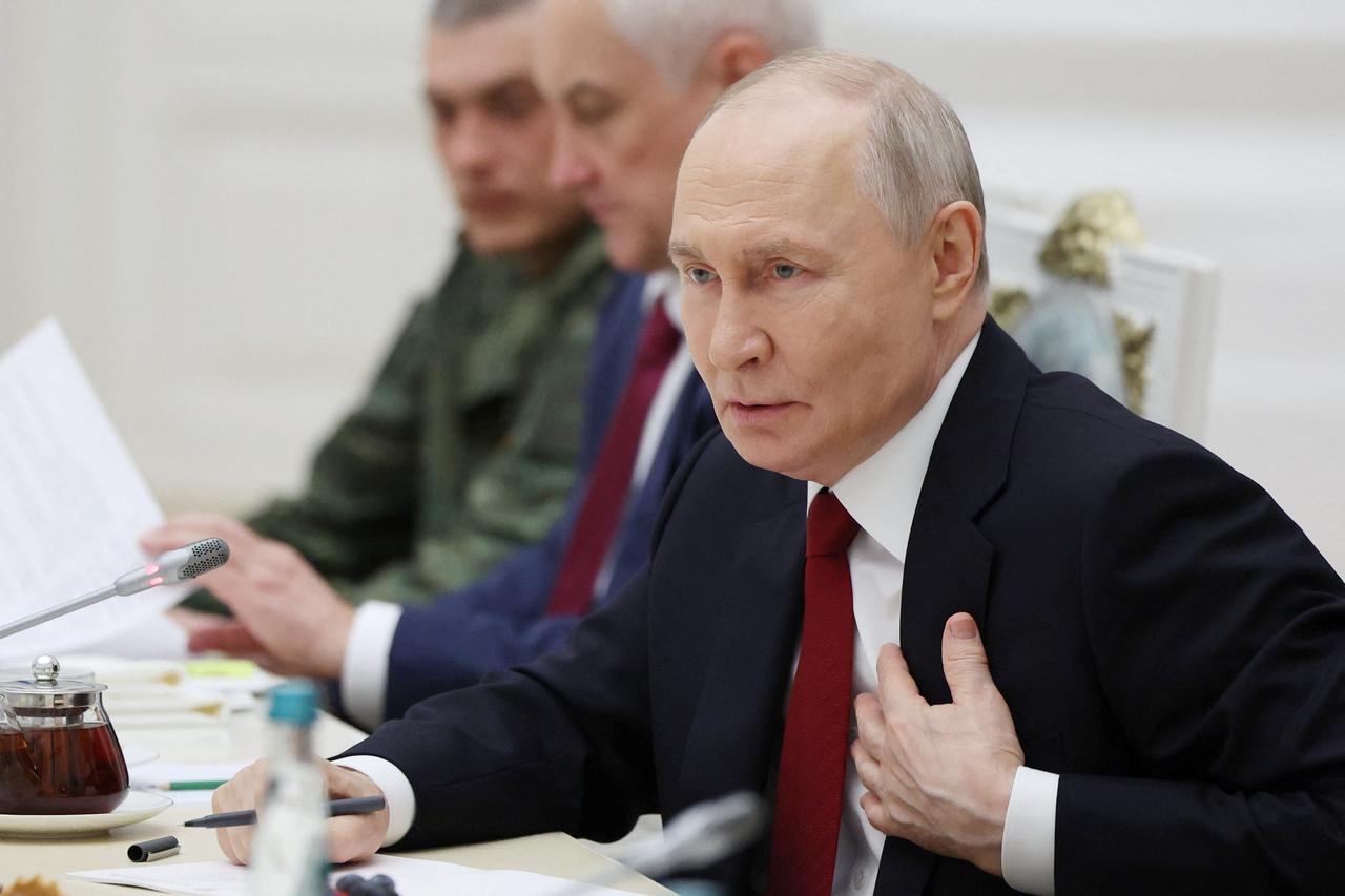 Russia's President Putin meets with service members in Moscow