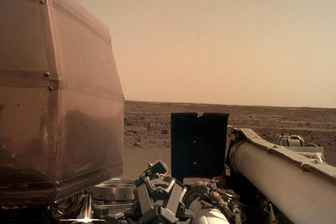 FILE PHOTO: The Instrument Deployment Camera's image of the Martian surface the day the spacecraft touched down on the Red Planet