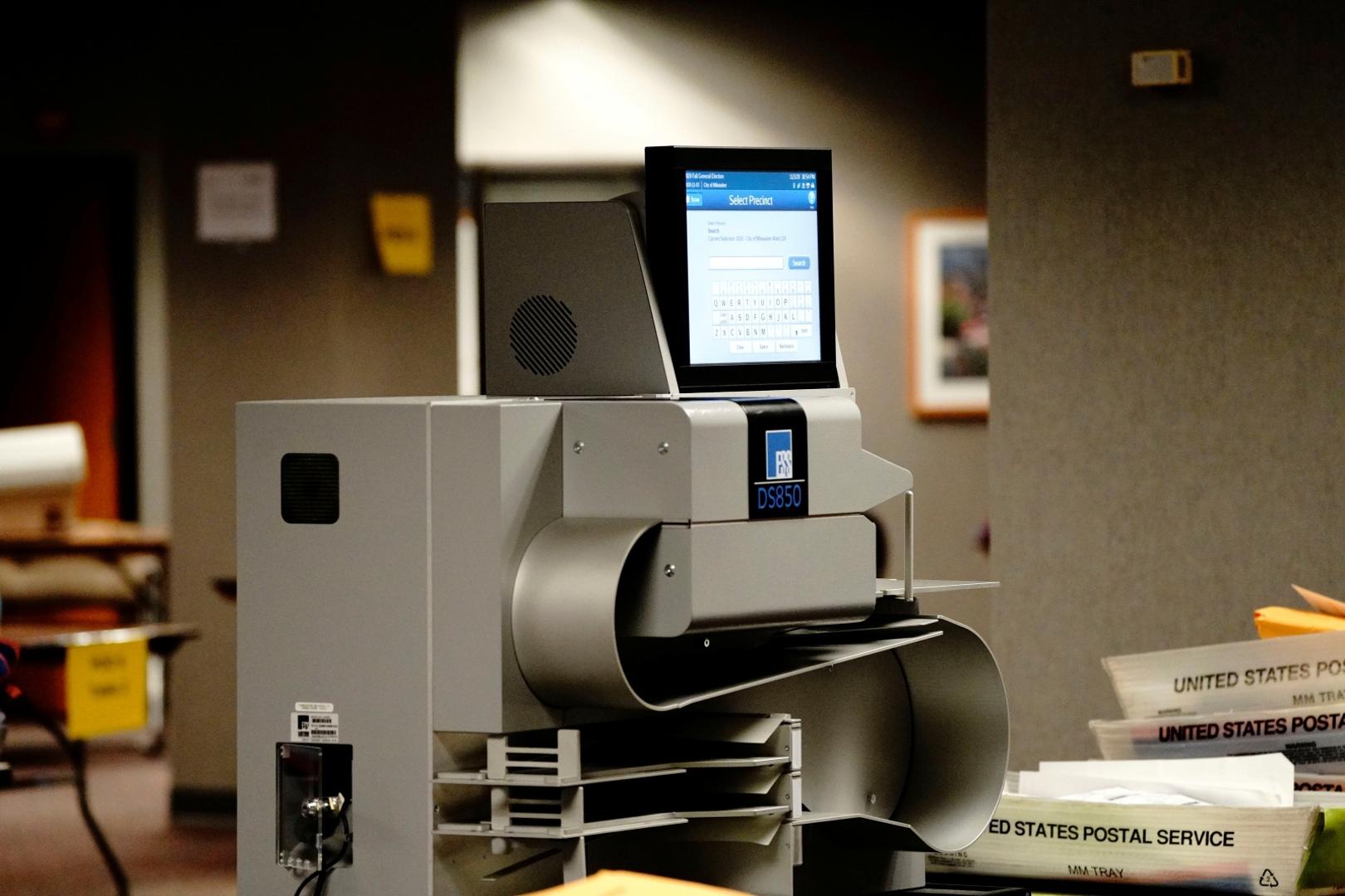 Counting absentee ballots at Milwaukee Central Count An ESS (Elections Systems & Software) DS850 high-speed central scanner and vote tabulator is seen at Milwaukee Central Count as absentee ballots are counted the night of Election Day in Milwaukee, Wisconsin, U.S., November 3, 2020. REUTERS/Bing Guan BING GUAN