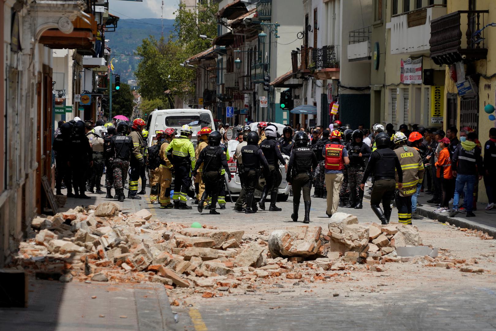 A damaged car and rubble from a house affected by the earthquake are pictured in Cuenca, Ecuador. March 18, 2023. REUTERS/Rafa Idrovo Espinoza NO RESALES. NO ARCHIVES Photo: Stringer/REUTERS
