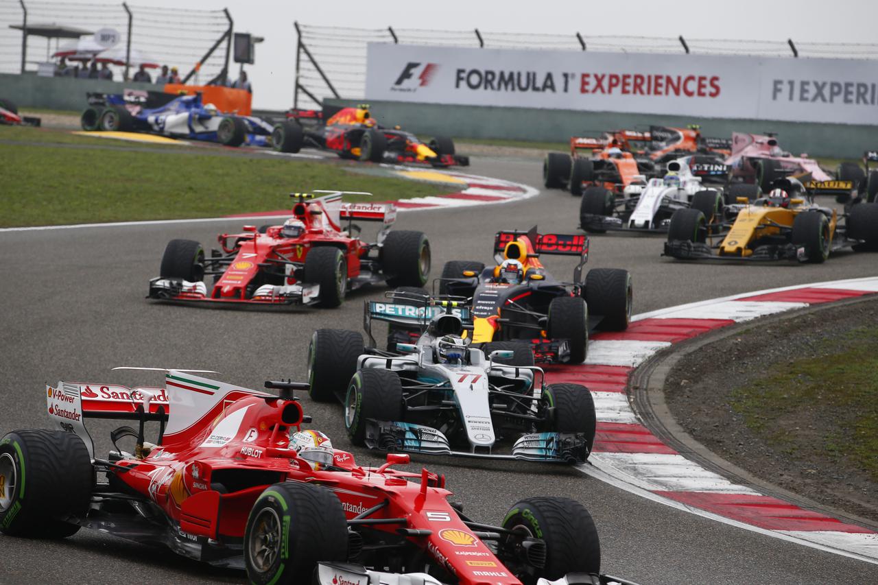 Shanghai: Motorsports: FIA Formula One World Championship 2017 #77 Valtteri Bottas (FIN, Mercedes AMG Petronas) #5 Sebastian Vettel (GER, Scuderia Ferrari) Start Chinese Formula One Grand Prix Shanghai Circuit on April 09, 2017 in Shanghai, China. (Photo 