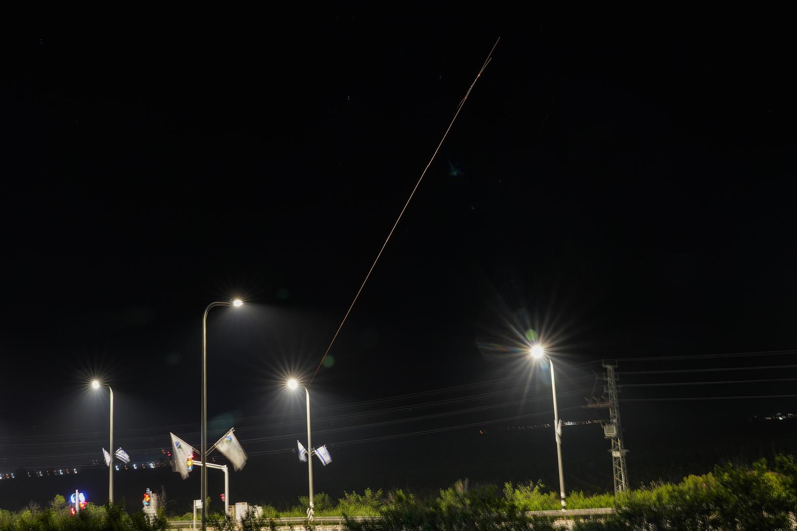 (240414) -- KIRYAT SHEMONA, April 14, 2024 (Xinhua) -- This long exposure photo taken on April 14, 2024 shows traces of miles and flares from explosions in the sky over Kiryat Shemona as Israel's anti-missile system intercepts missiles and drones from Iran. A combined attack of dozens of ballistic missiles and hundreds of drones from Iran triggered air raid alerts across Israel early on Sunday, the Israeli army said, as residents reported multiple bombings were heard.    Israel Defense Forces (IDF) Spokesman Daniel Hagari confirmed during a press briefing that Israel was under attack by ballistic missiles and unmanned aerial vehicles from Iran, noting that aerial defense systems have intercepted some of the missiles. (Ayal Margolin/JINI via Xinhua) Photo: Ayal Margolin/JINI/XINHUA