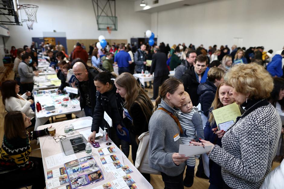 Ukrainian refugees attend a job fair in Brooklyn, New York