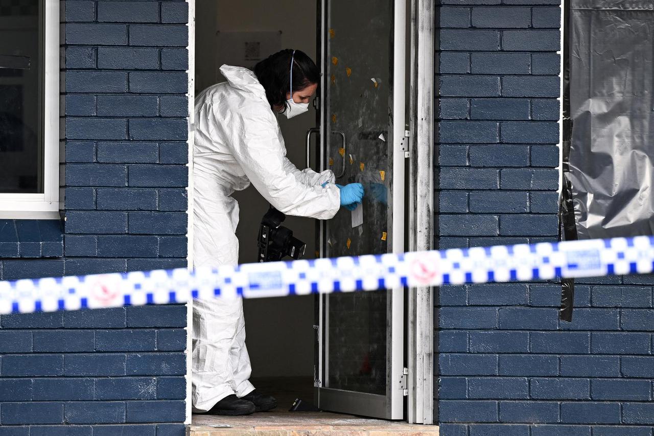 NSW Police and forensics officers work at a crime scene in North Parramatta, in Sydney