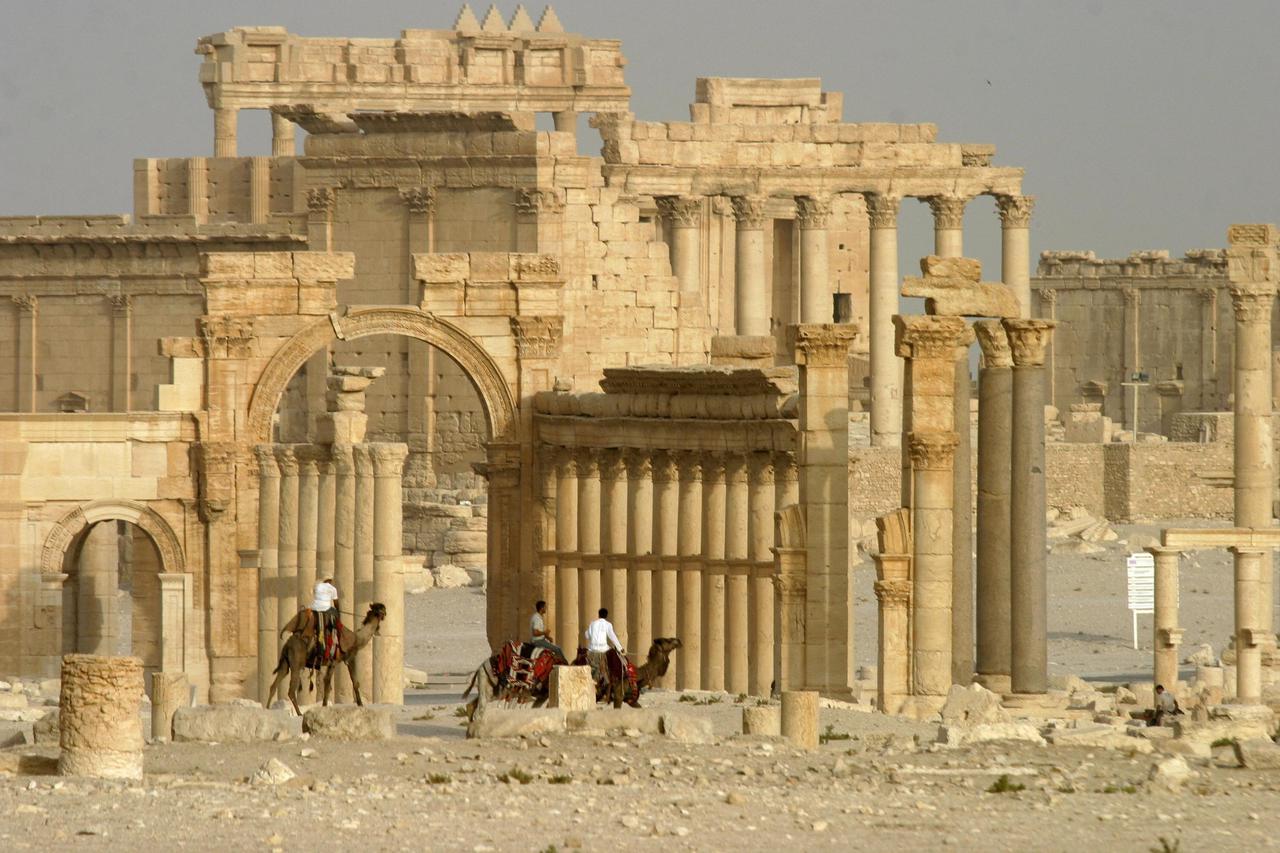Columns and the ancient Temple of Bel are seen in the historical city of Palmyra, Syria, June 11, 2009. Satellite images have confirmed the destruction of the Temple of Bel, which was one of the best preserved Roman-era sites in the Syrian city of Palmyra