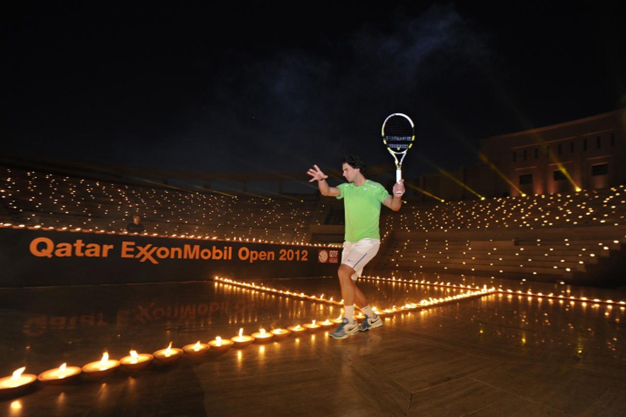 'In this photo released by Qatar Tennis Federation (QTF) on January 1, 2012, tennis star Rafael Nadal takes part in a show case ahead of the Qatar ExxonMobil Open and the 2012 ATP World Tour season at