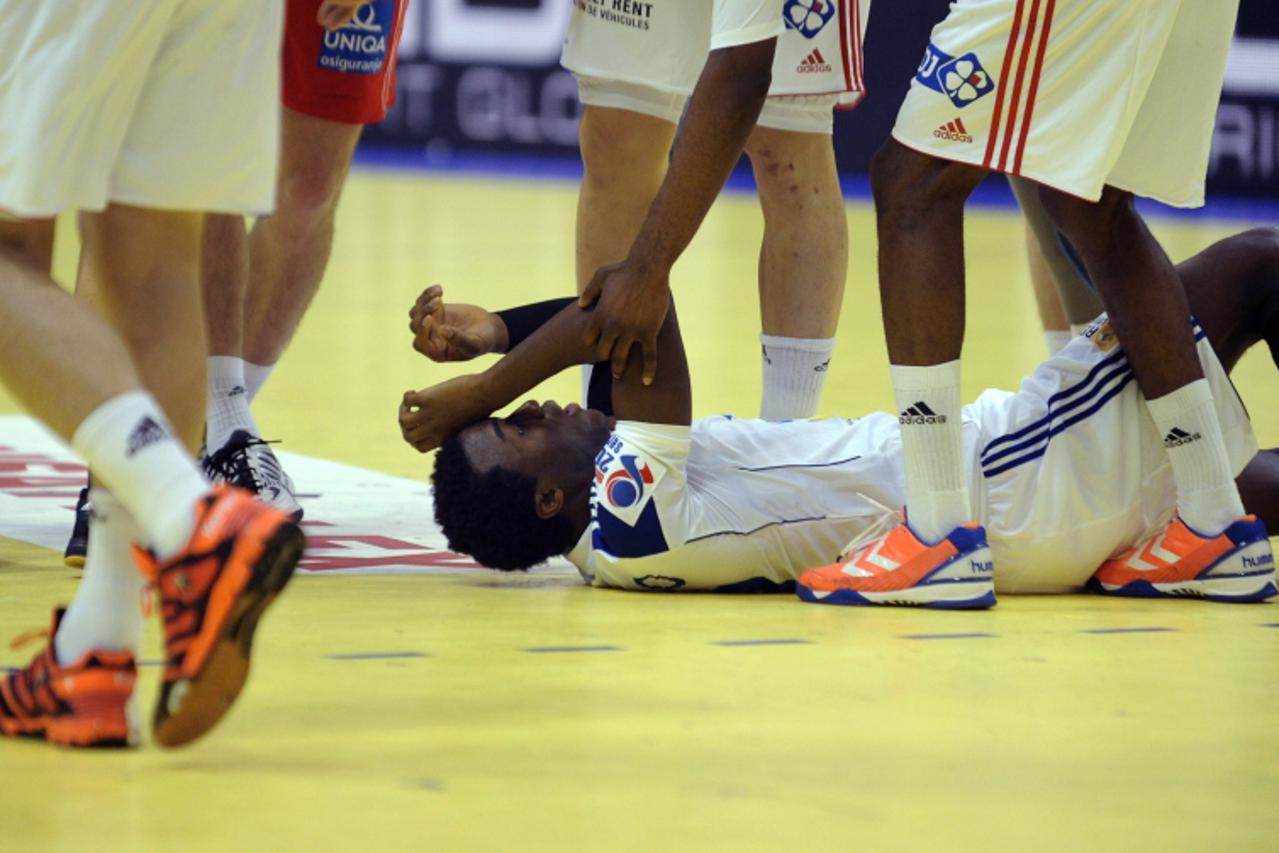 'French Luc Abalo lays on the floor during the Men\'s EHF Euro 2012 Handball Championship match between France and Croatia on January 24, 2012, at the Spens Hall in Novi Sad.  Croatia won 29-22. AFP P