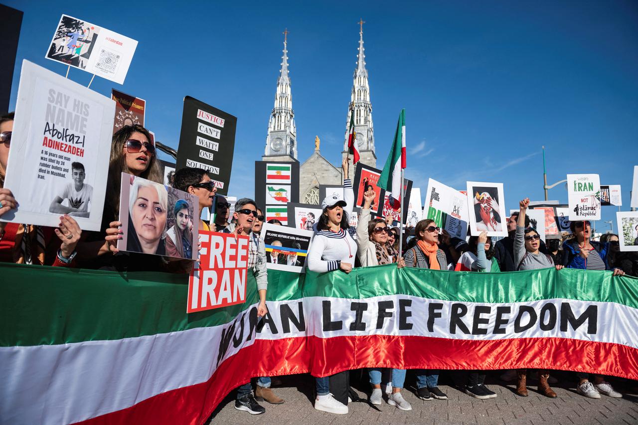 FILE PHOTO: Protestors in support of women in Iran hold a banner reading 'Women Life Freedom' during a protest in Ottawa