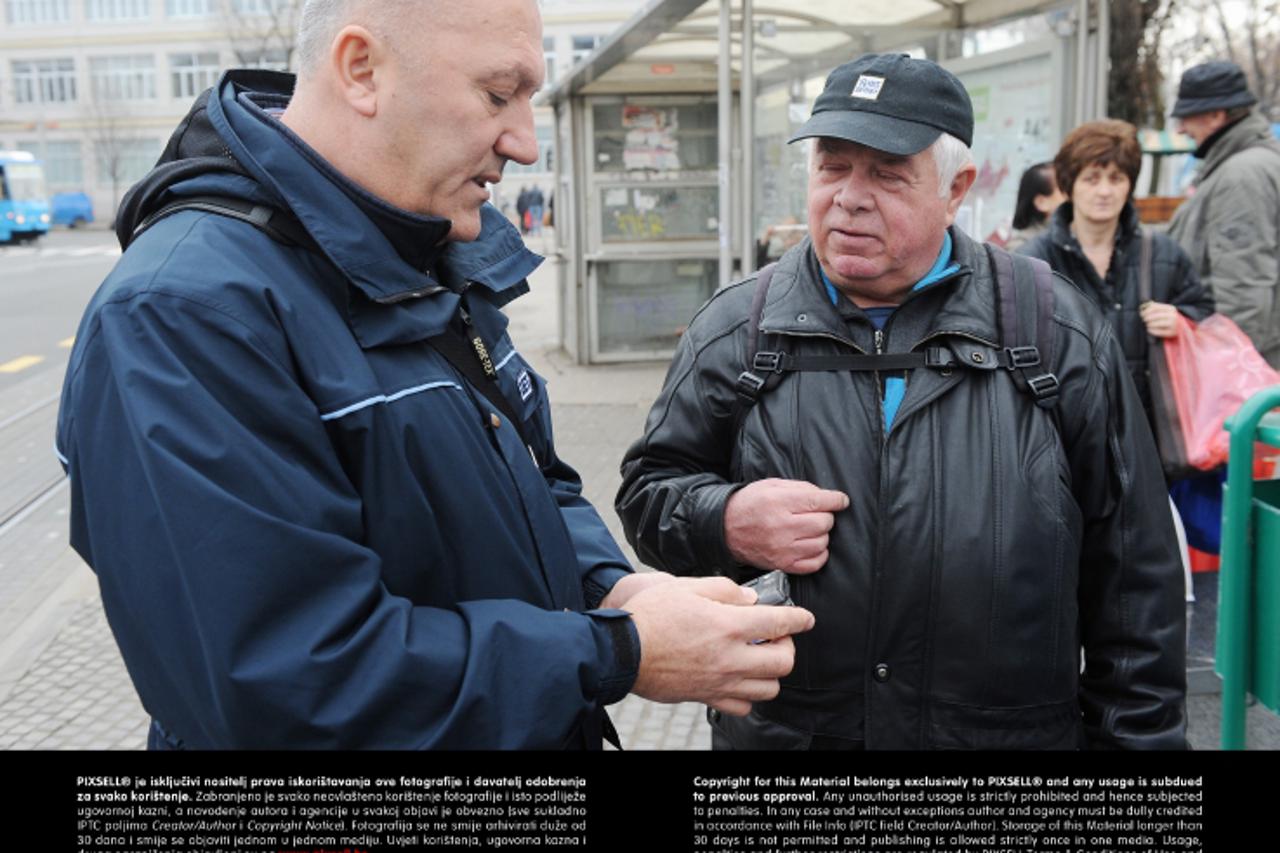 '10.01.2013., Zagreb -  Reportaza o kontrolorima ZET-a. Kontrolori Zeljko Marinovic i Davor Guja pregledavali su karte putnika u tramvajima.  Photo: Davor Visnjic/PIXSELL'