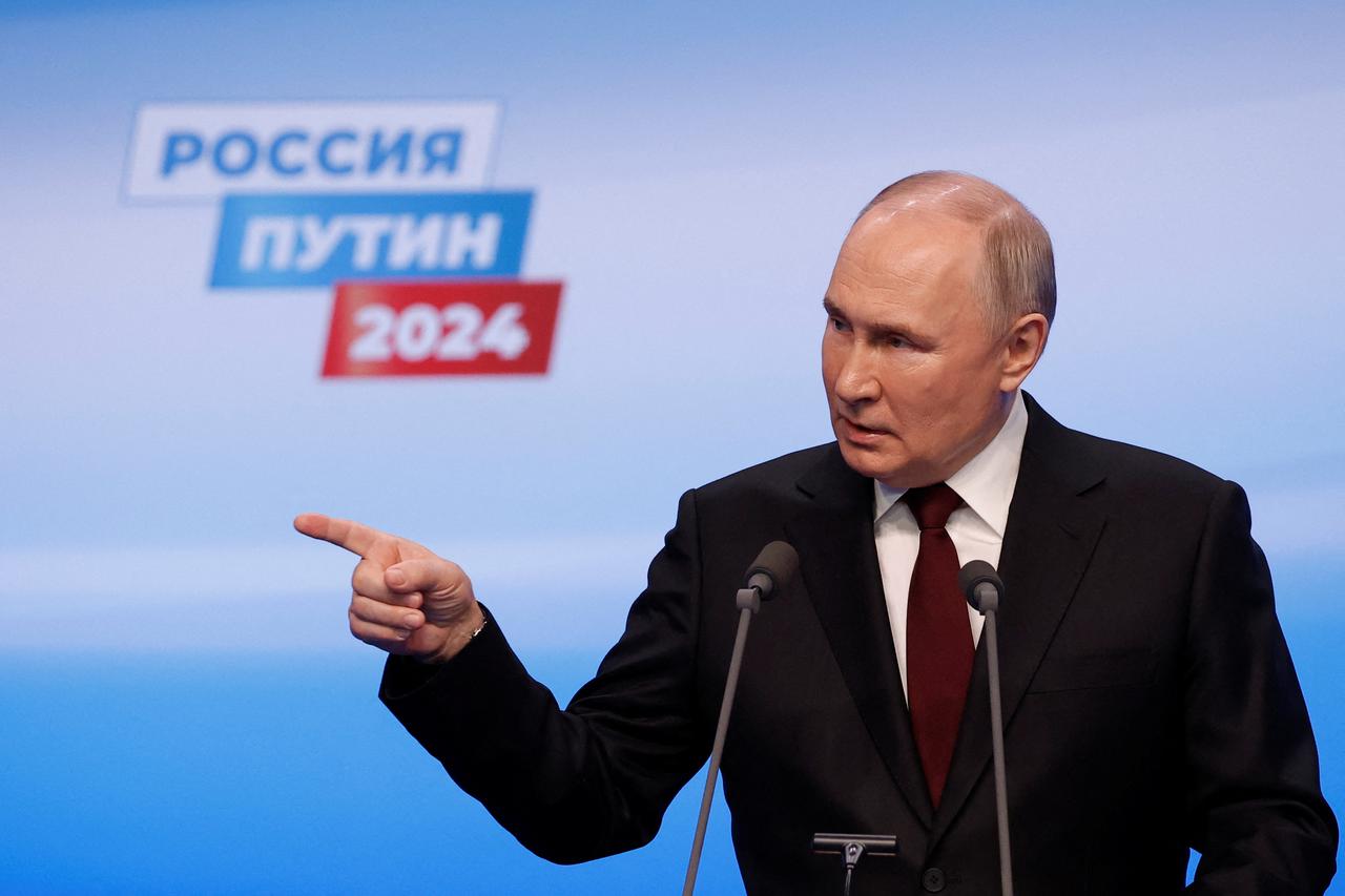 Russian incumbent President Putin speaks after polling stations closed, in Moscow