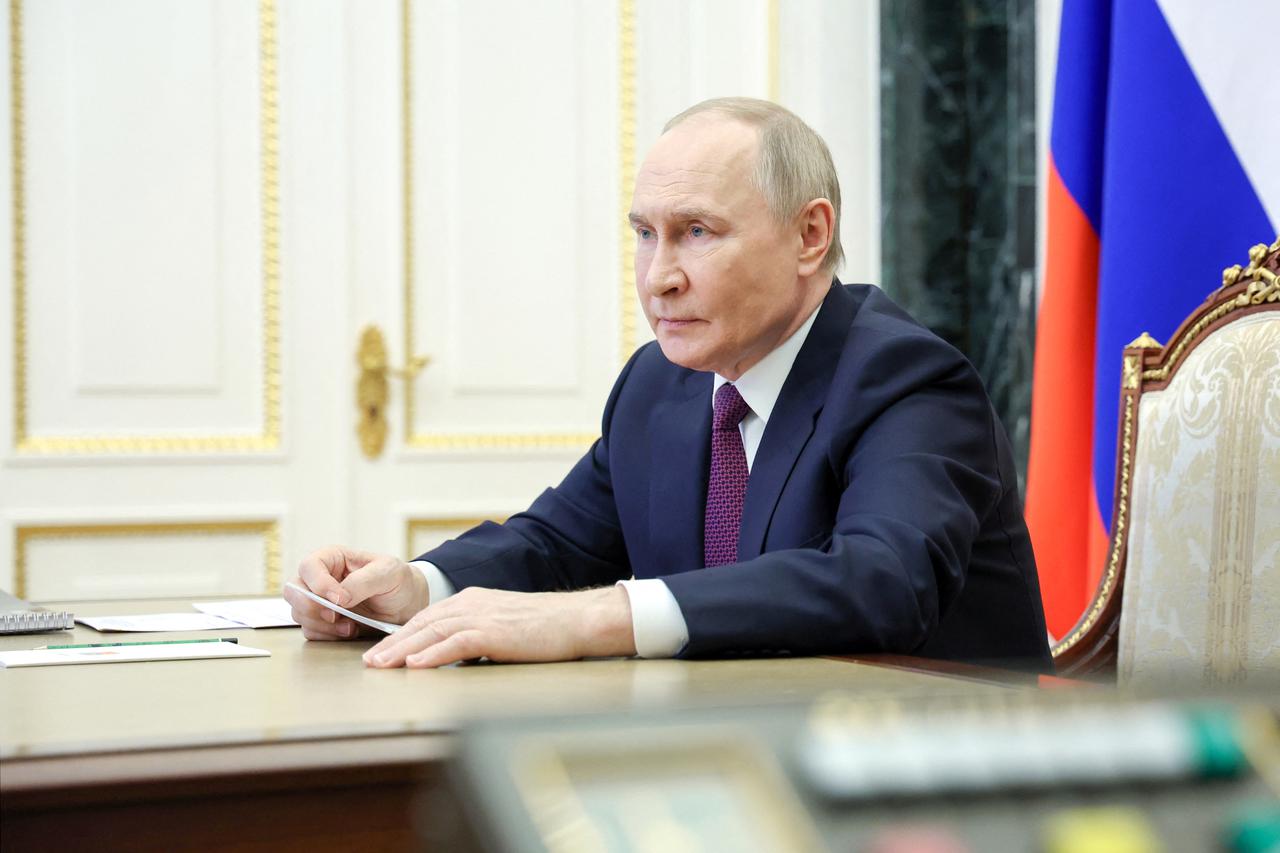Russian President Vladimir Putin chairs a meeting with members of the government in Moscow