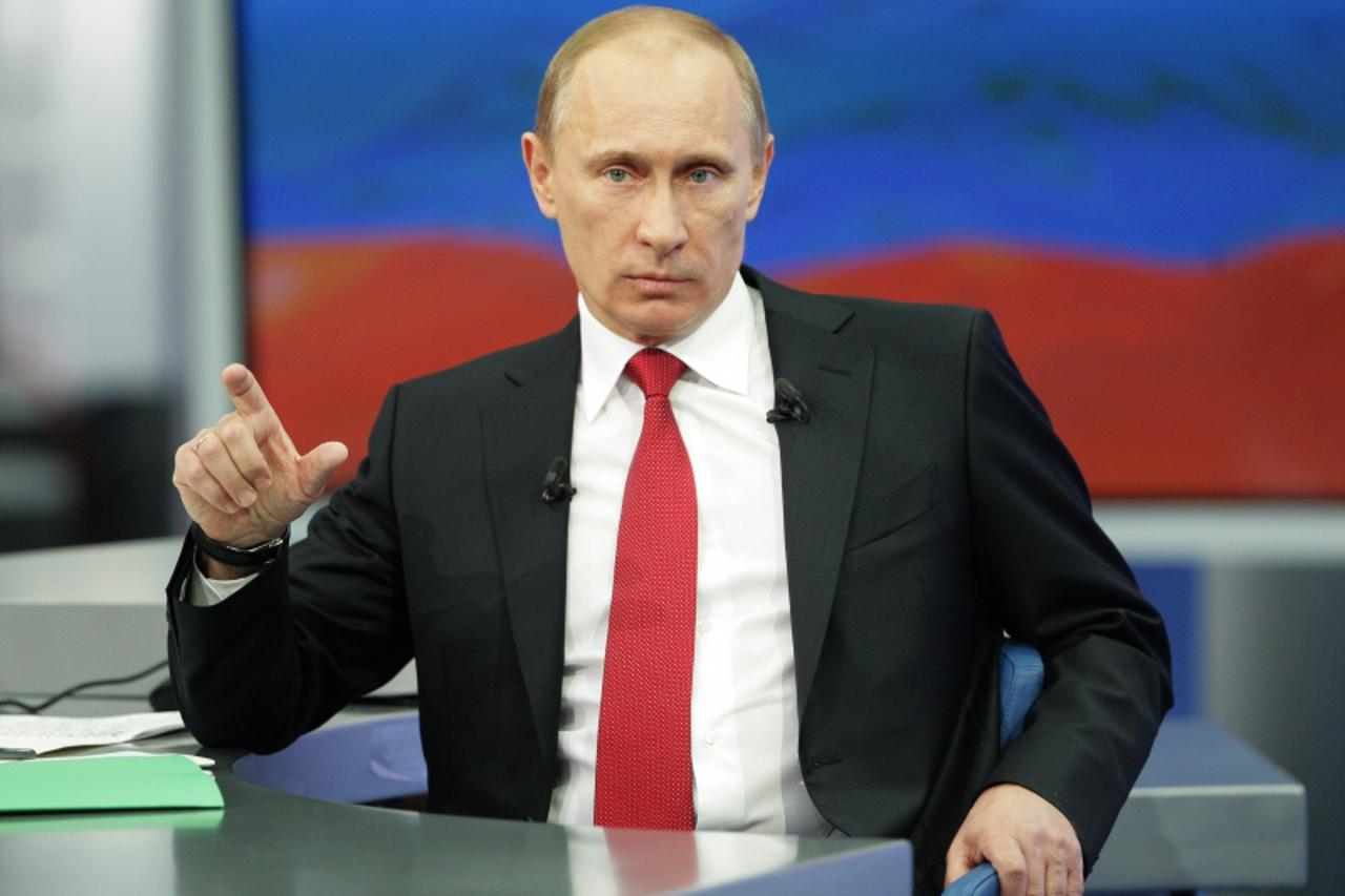 'Prime Minister Vladimir Putin speaks during his annual TV marathon question-and-answer session with Russians in Moscow, on December 16, 2010.  AFP PHOTO/ RIA-NOVOSTI POOL/ ALEXEY DRUZHININ'
