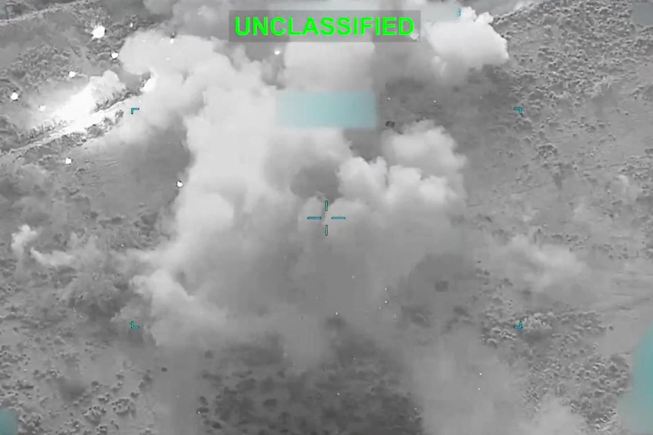 still image released by U.S. Central Command (CENTCOM) shows shows a flight deck crew member signaling an F‑35 jet on an aircraft carrier