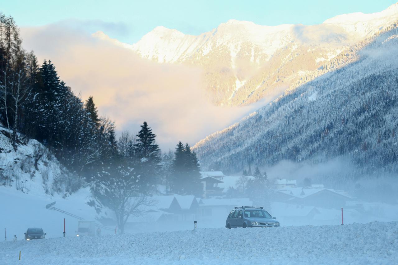 FILE PHOTO: Cars are seen on the road near the town of Winklern