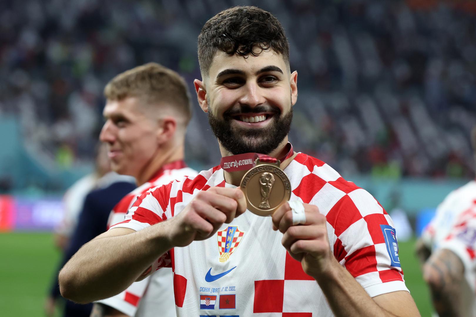 Bio je ključni igrač Hrvatske u pohodu na Svjetsku broncu 2022., a zabio je i pogodak protiv Maroka u utakmici za treće mjesto. Ukupno je za reprezentaciju odigrao 46 utakmica i zabio četiri gola.