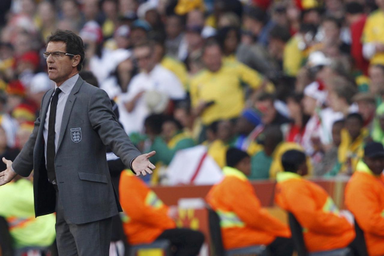 'England\'s coach Fabio Capello reacts during a 2010 World Cup second round soccer match against Germany at Free State stadium in Bloemfontein June 27, 2010. REUTERS/Darren Staples (SOUTH AFRICA  - Ta