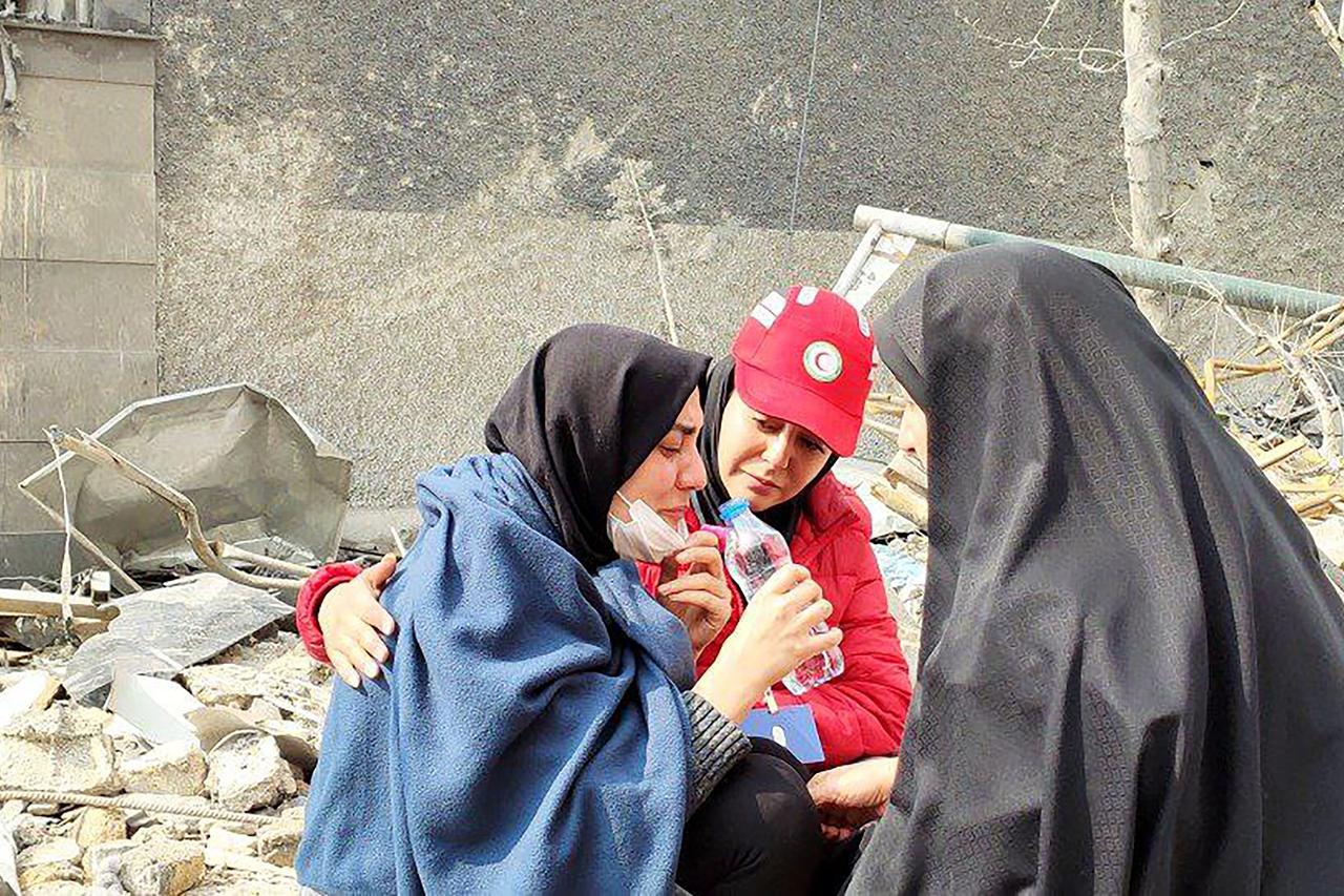 Rescue Teams work at Tehran Airstrike-Damaged Building