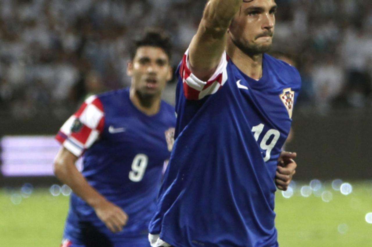 'Croatia\'s Niko Kranjcar (R) celebrates after scoring a goal during their Euro 2012 qualifying soccer match against Israel in Ramat Gan, near Tel Aviv October 9, 2010.  REUTERS/Nir Elias (ISRAEL - Ta