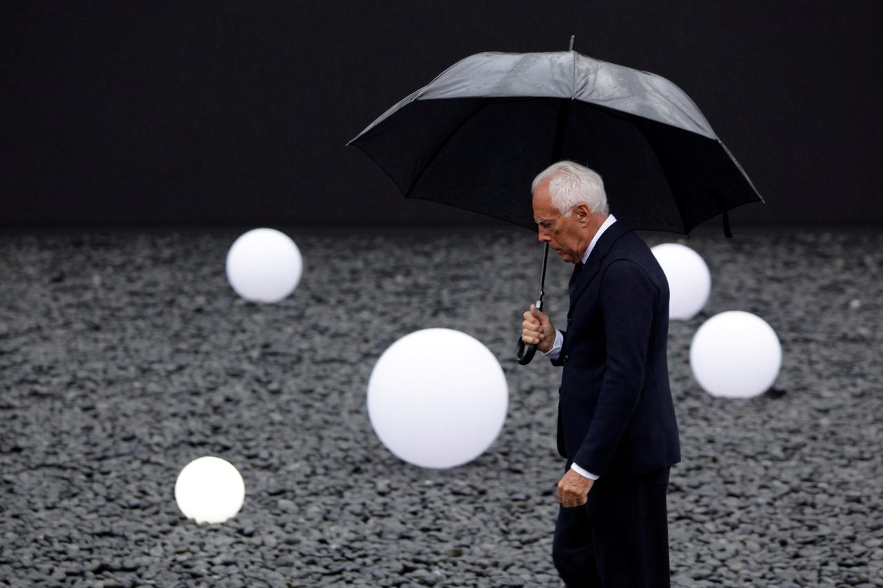FILE PHOTO: FILE PHOTO: Armani brand founder Giorgio Armani walks outside the venue for his fashion show in Beijing
