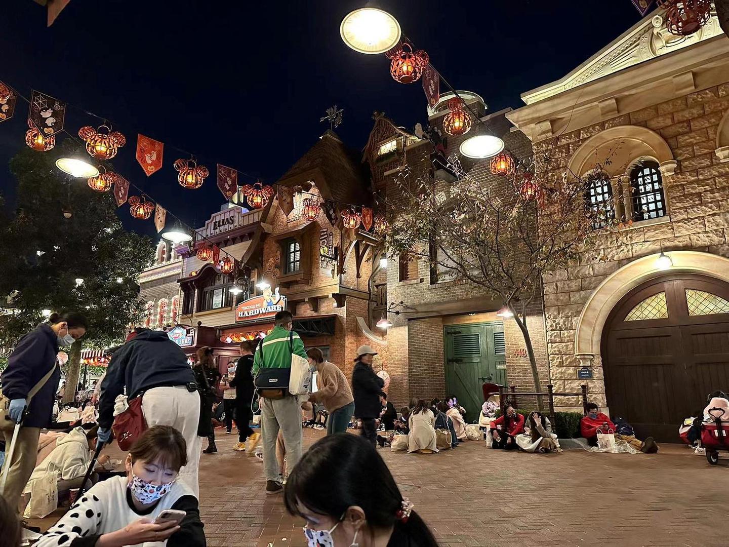 People sit inside the Shanghai Disney Resort amidst the coronavirus disease (COVID-19) outbreak, in Shanghai, China October 31, 2022 in this picture obtained by REUTERS.  THIS IMAGE HAS BEEN SUPPLIED BY A THIRD PARTY. NO RESALES. NO ARCHIVES. Photo: SOCIAL MEDIA/REUTERS
