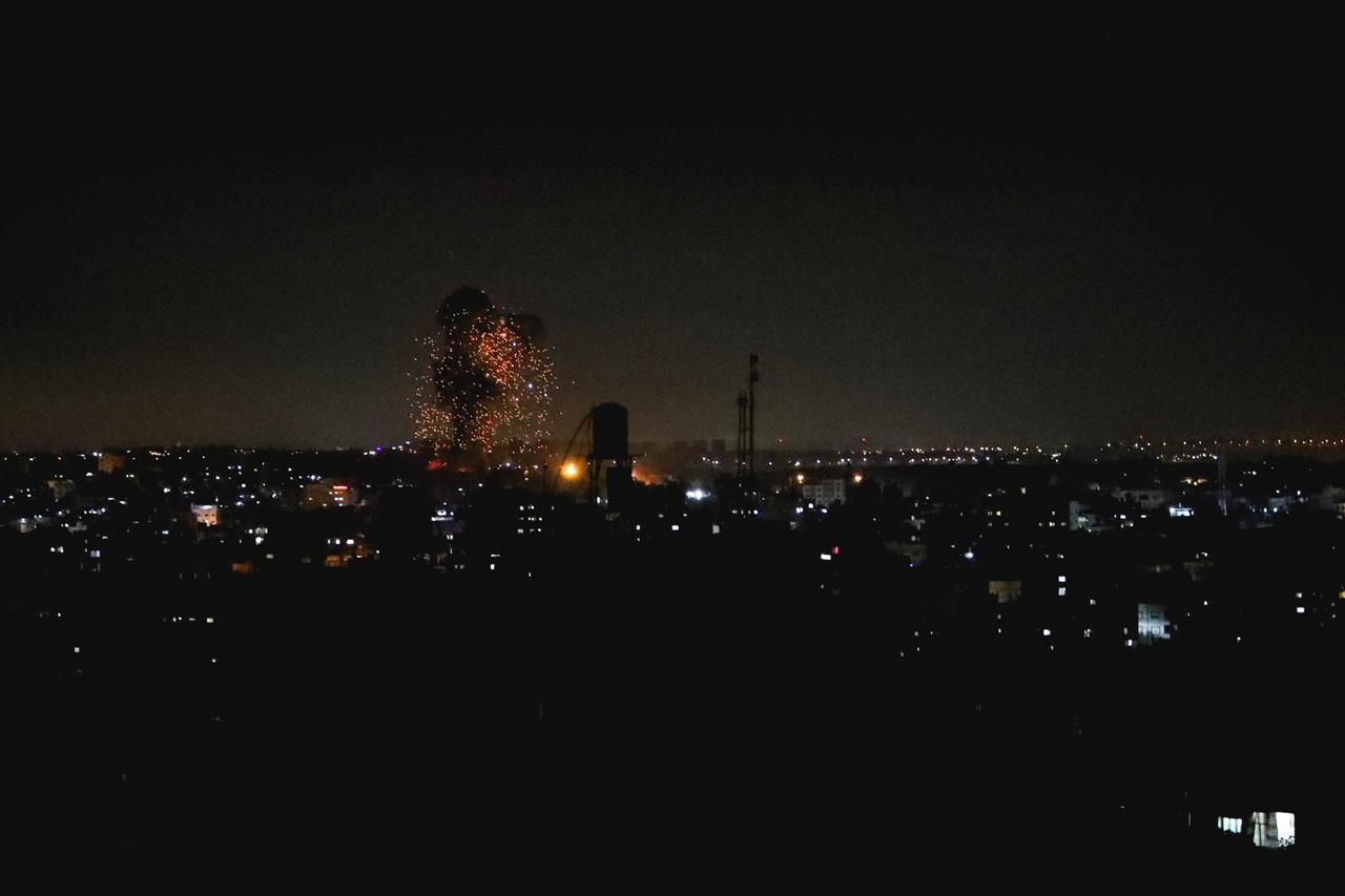 Smoke and flames are seen after an Israeli air strike in the northern Gaza Strip