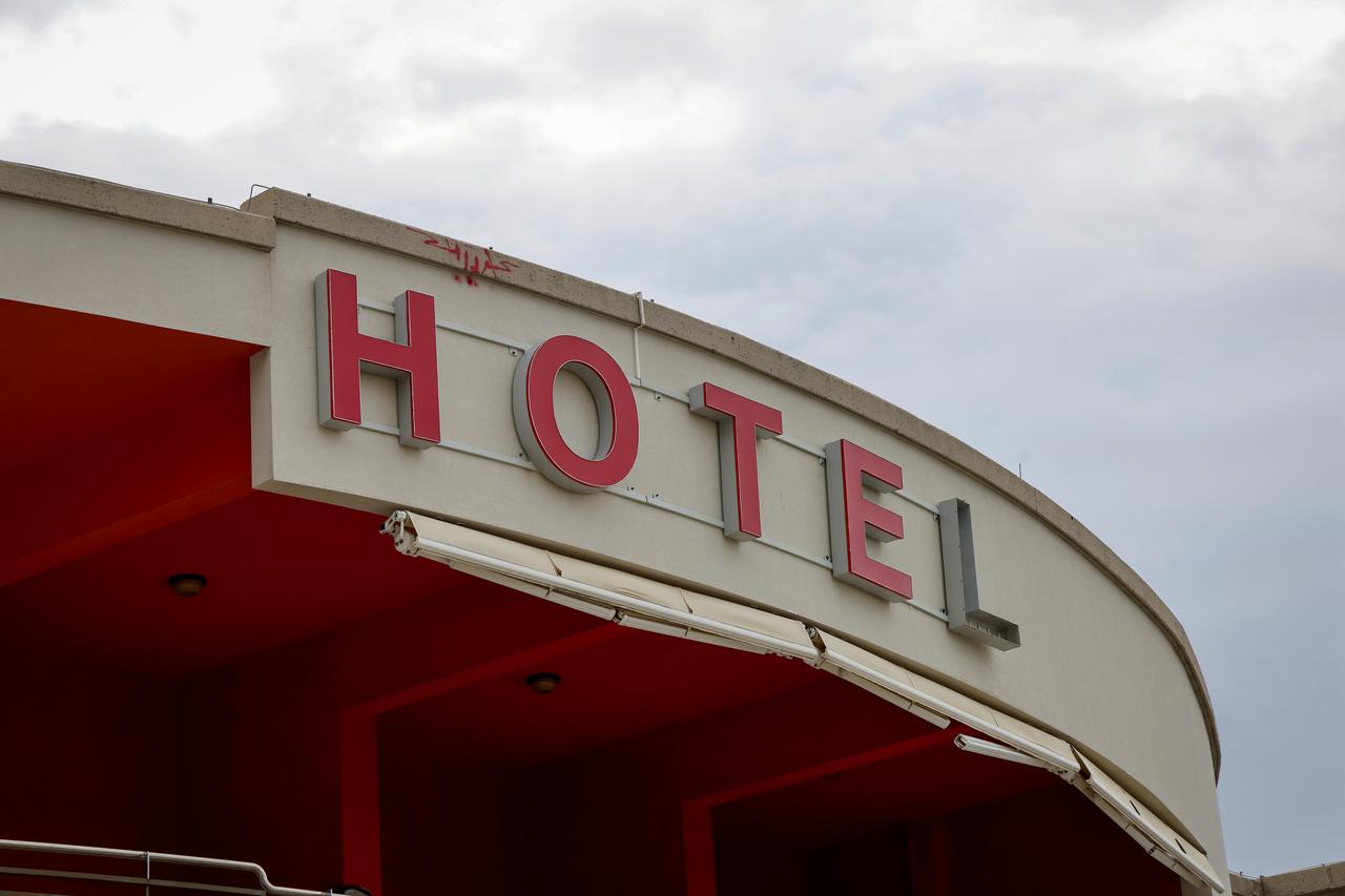 Rescuers work in the rubble of residential buildings after air strikes, in the Resalat neighborhood