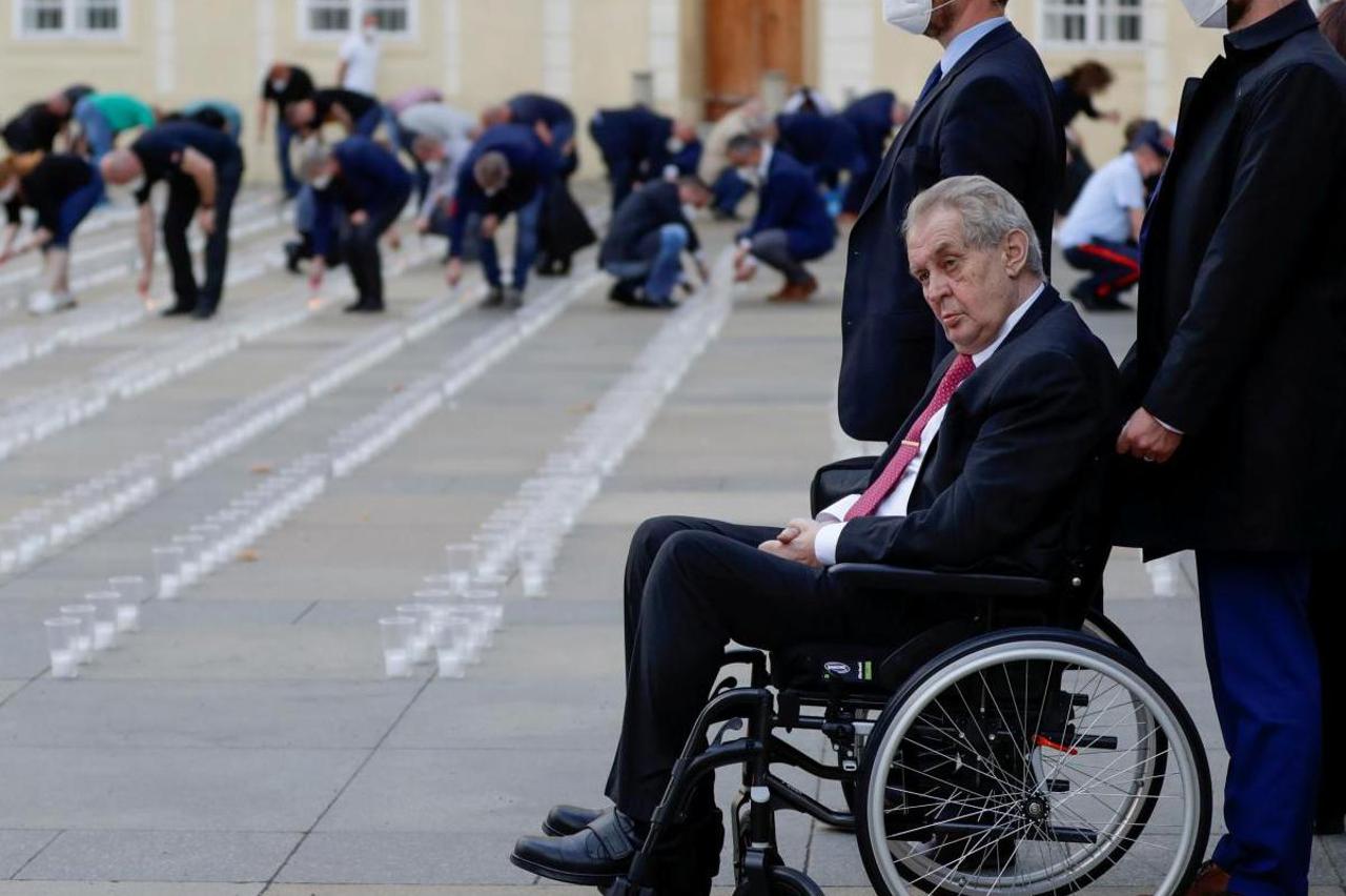 FILE PHOTO: Employees of the Prague Castle light candles to commemorate COVID-19 victims in Prague