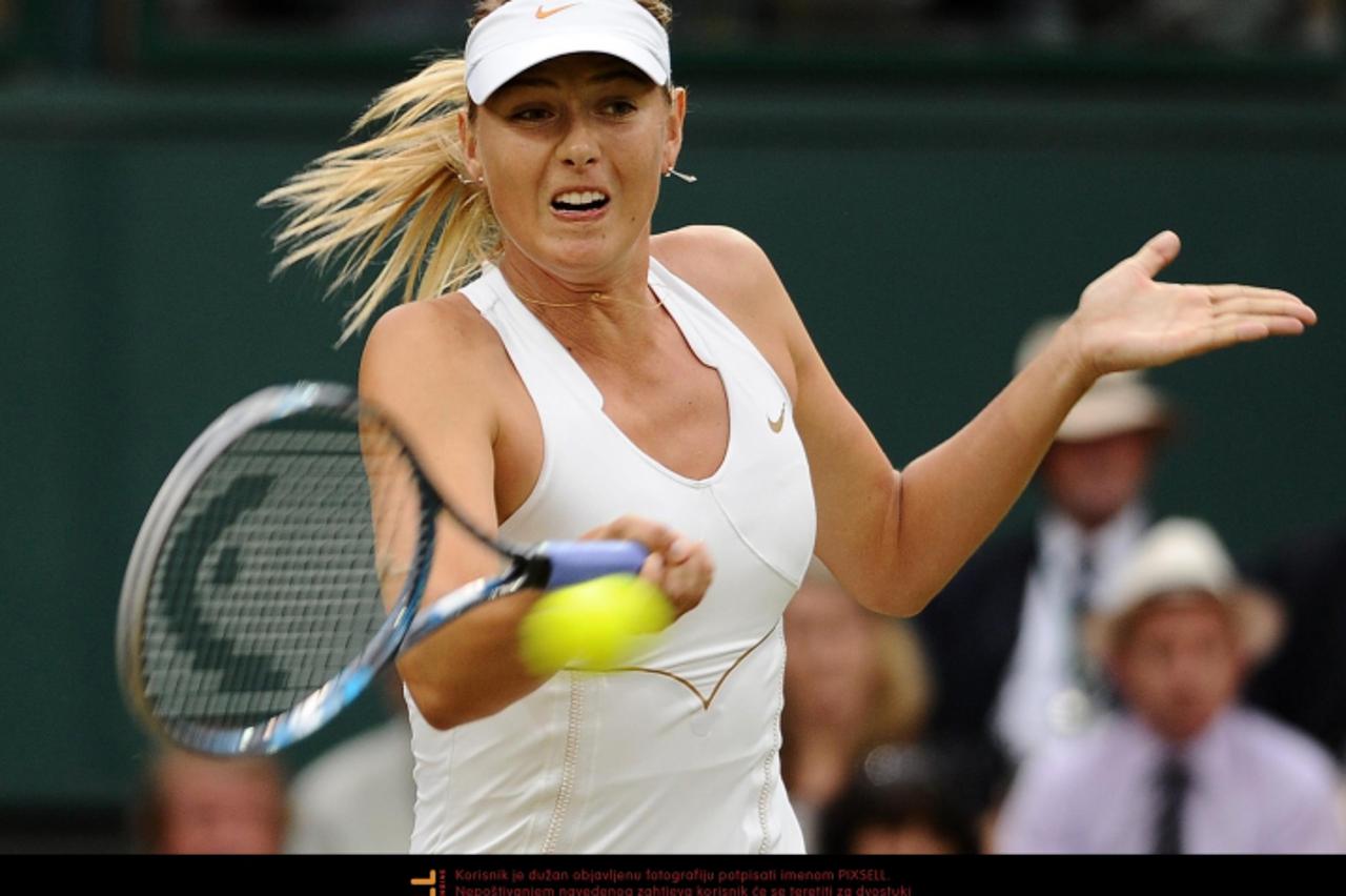 'Russia\'s Maria Sharapova in action against Slovakia\'s Dominika Cibulkova during day eight of the 2011 Wimbledon Championships at the All England Lawn Tennis and Croquet Club, Wimbledon. Photo: Pres