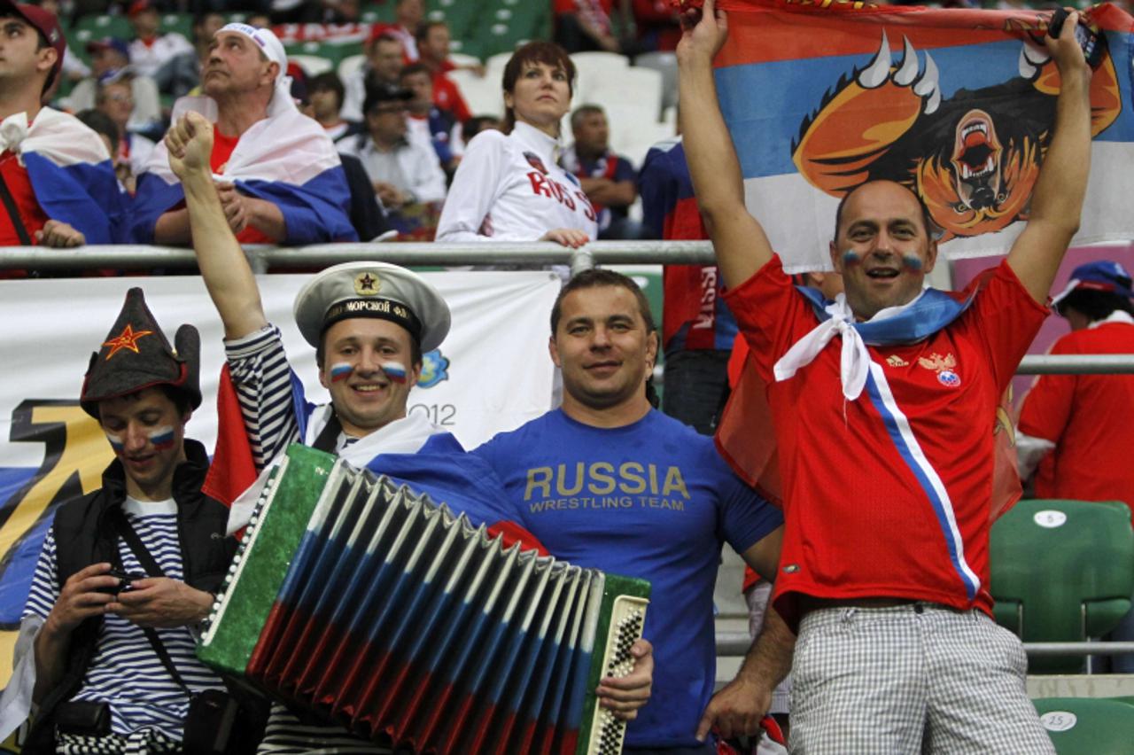 'Fans of Russia cheer before the start of their Group A Euro 2012 soccer match against Czech Republic at the city stadium in Wroclaw June 8, 2012.   REUTERS/Kacper Pempel (POLAND  - Tags: SPORT SOCCER