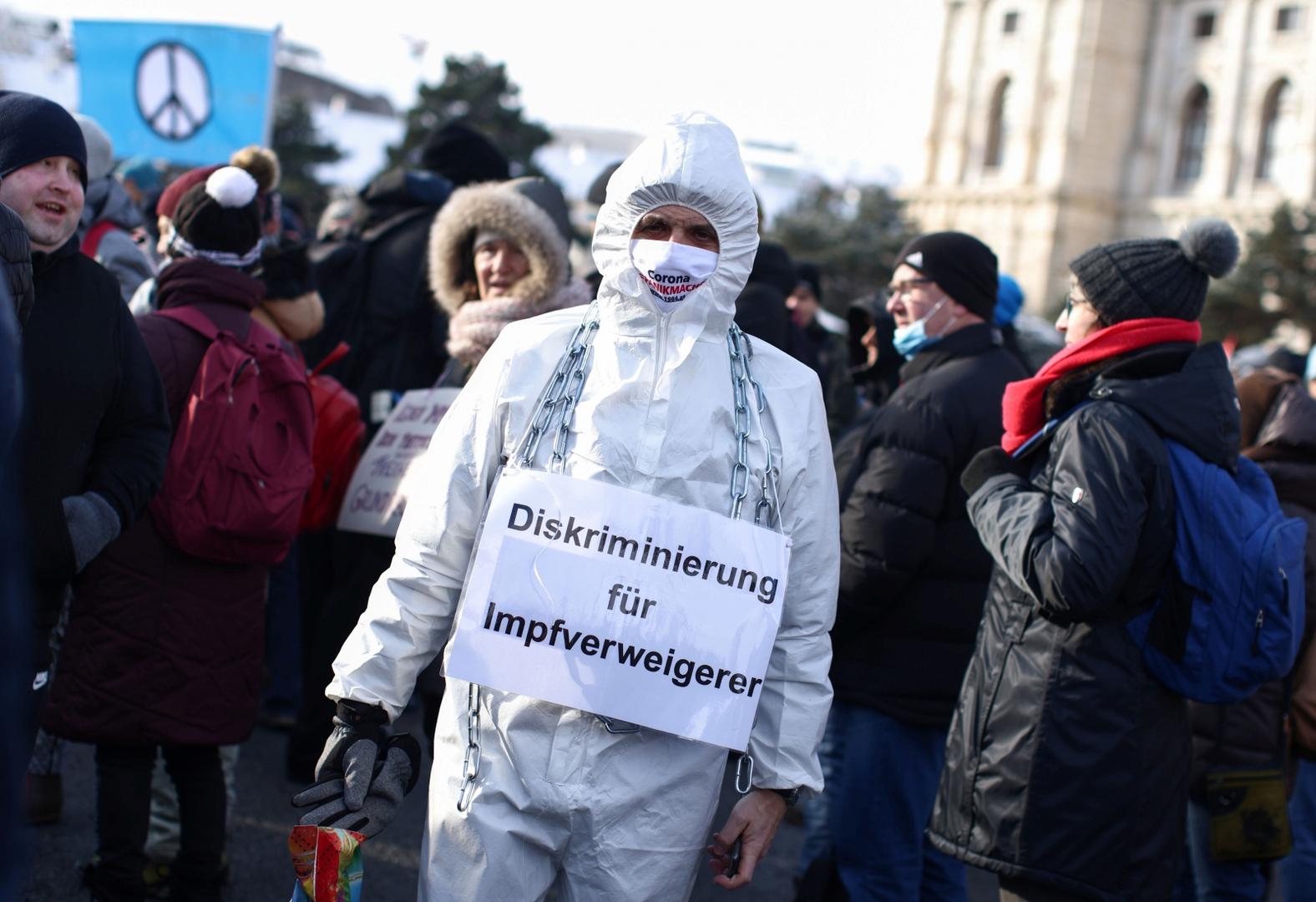 Demonstration against the COVID-19 measures and their economic consequences, in Vienna A protestor wears a sign reading "discrimination for vaccination refusers" during a demonstration against the coronavirus disease (COVID-19) measures and their economic consequences in Vienna, Austria, January 16, 2021. REUTERS/Lisi Niesner LISI NIESNER