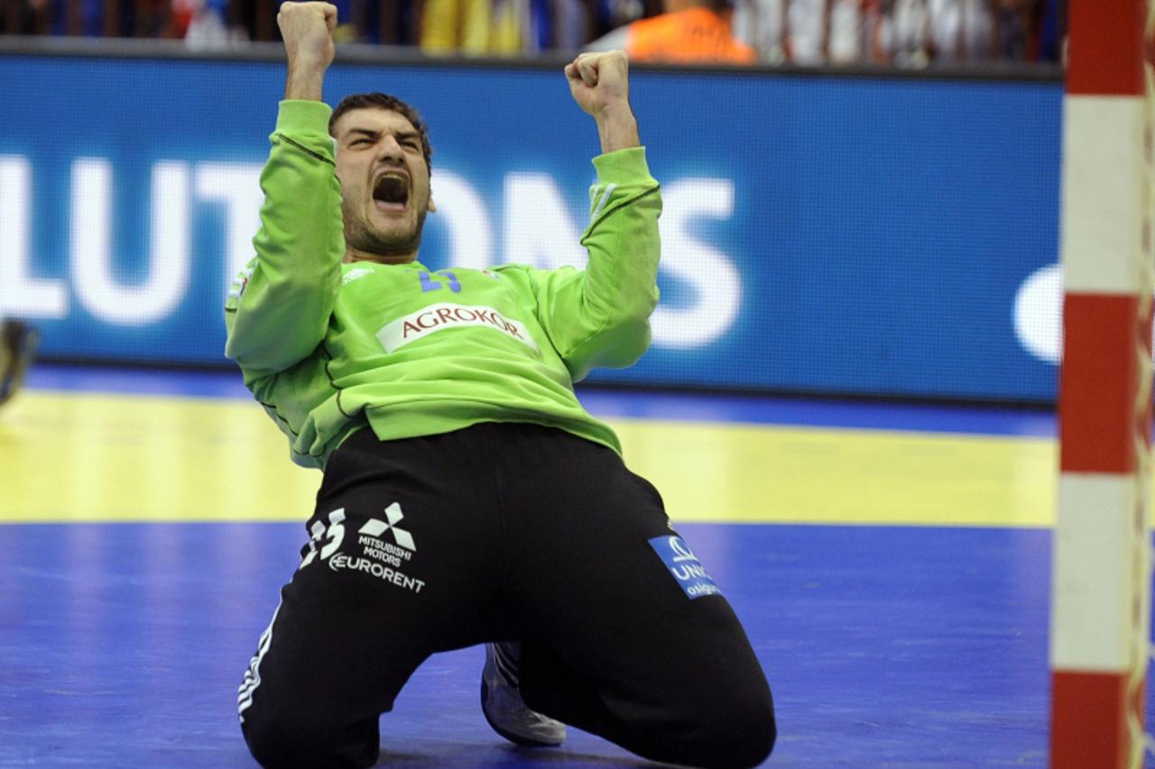 'Croatian goalkeeper Mirko Alilovic celebrates during the Men\'s EHF Euro 2012 Handball Championship match between France and Croatia on January 24, 2012, at the Spens Hall in Novi Sad.  Croatia won 2