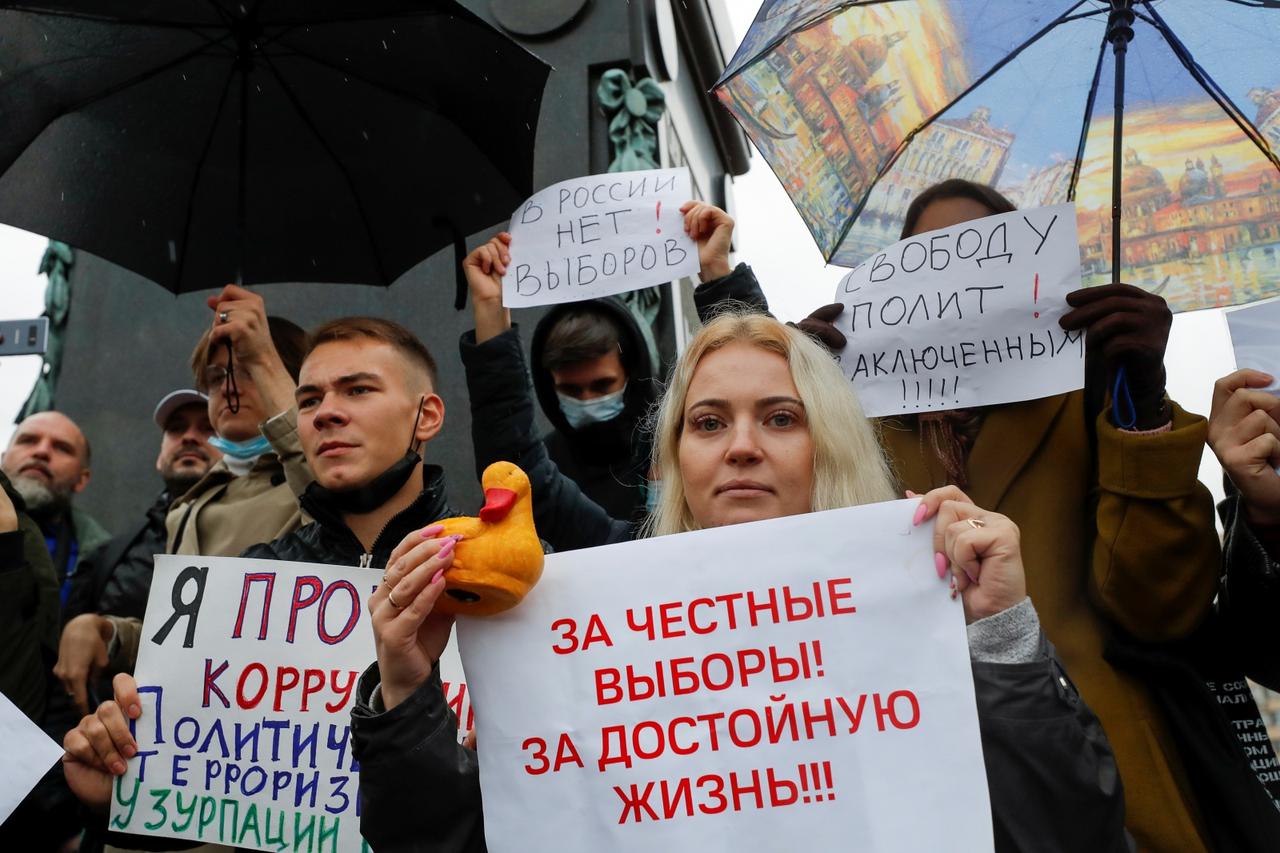 People protest against the results of a parliamentary election during an opposition rally in Moscow