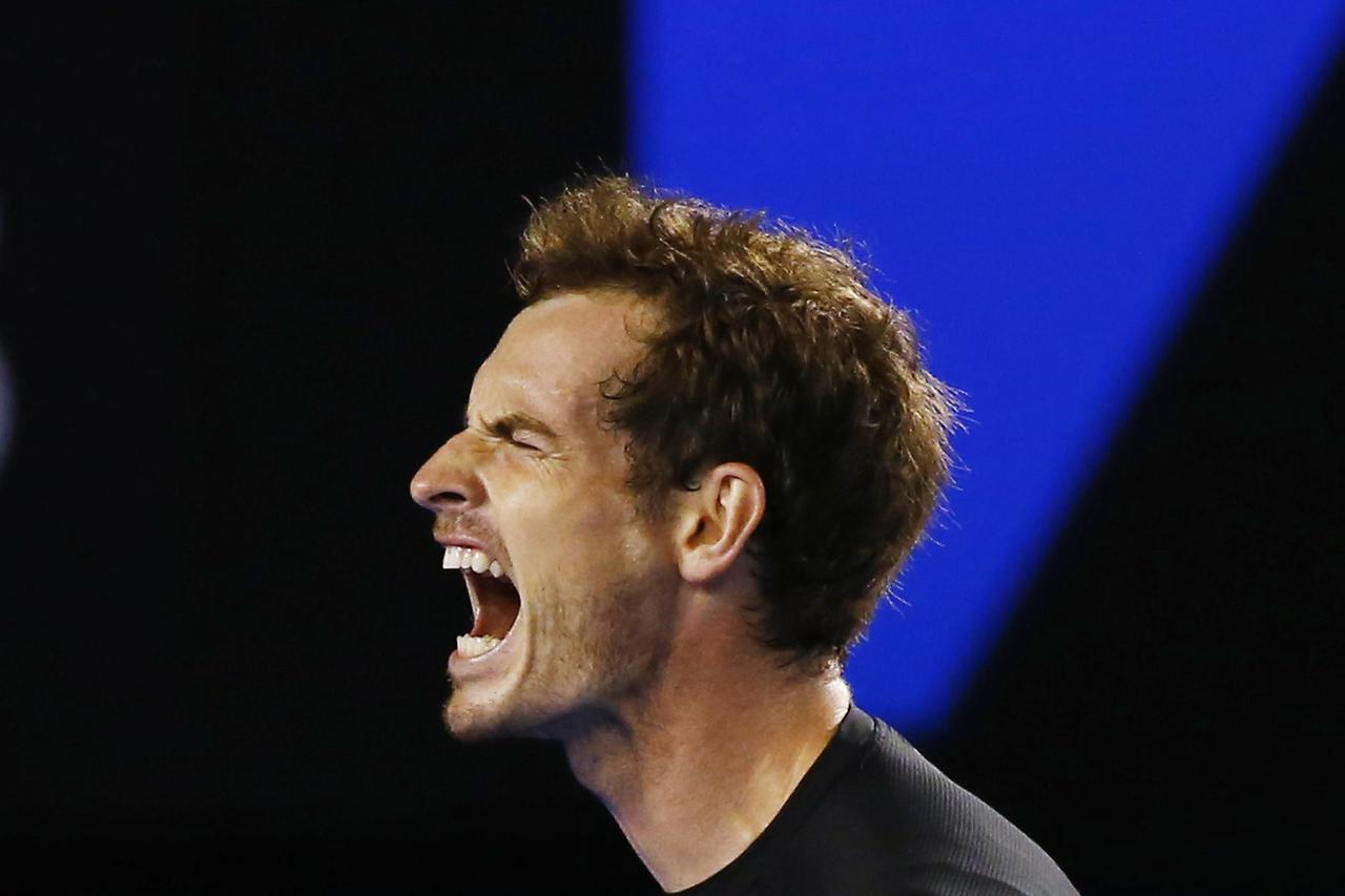 Andy Murray of Britain reacts after missing a shot against Novak Djokovic of Serbia during their men's singles final match at the Australian Open 2015 tennis tournament in Melbourne February 1, 2015. REUTERS/Issei Kato (AUSTRALIA  - Tags: SPORT TENNIS)