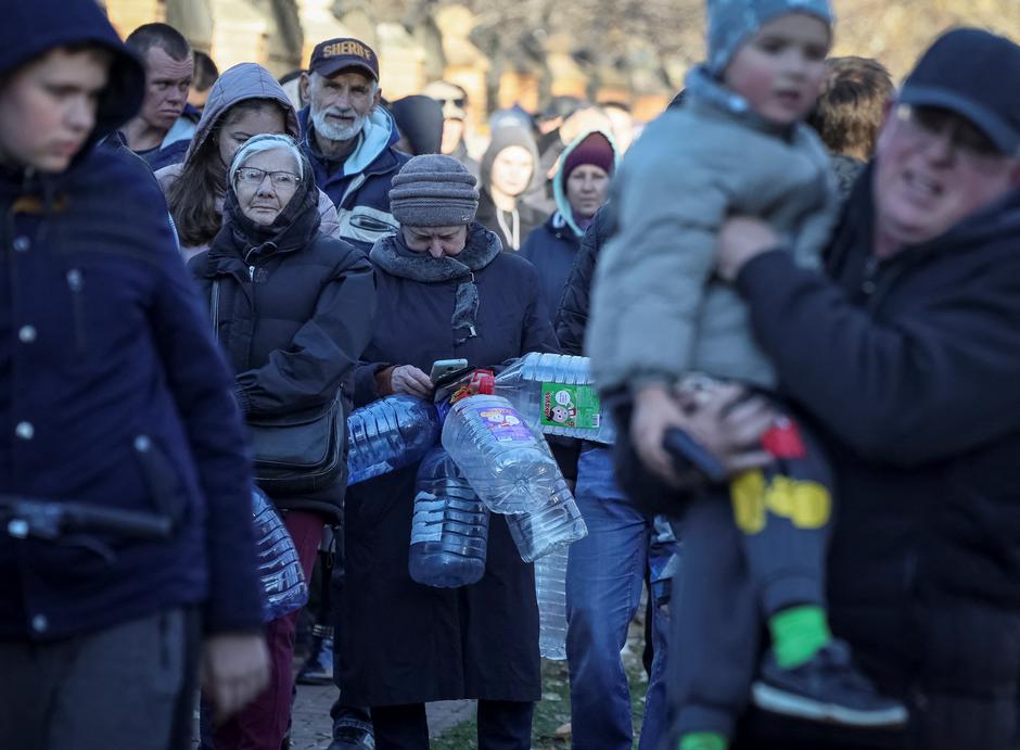 Local residents queue for water after a Russian missile attack in Kyiv