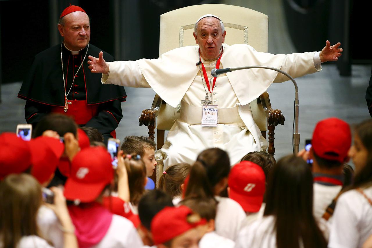 Pope Francis reacts during a special audience with members of the 