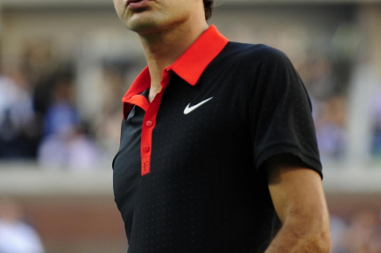 '(FILES) A picture taken on September 14, 2009 shows top seed Roger Federer of Switzerland during the US Open men\'s final against sixth-seeded Juan Martin Del Potro of Argentina at the USTA Billie Je
