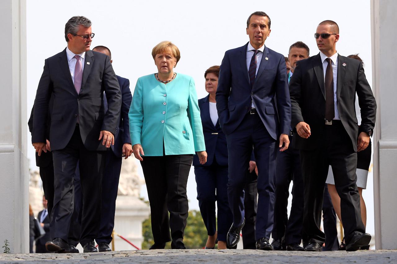 (L-R) Croatia's Prime Minister Tihomir Oreskovic, Germany's Chancellor Angela Merkel and Austria's Chancellor Christian Kern arrive to pose for a family photo during the European Union summit - the first one since Britain voted to quit - in Bratislava, Sl