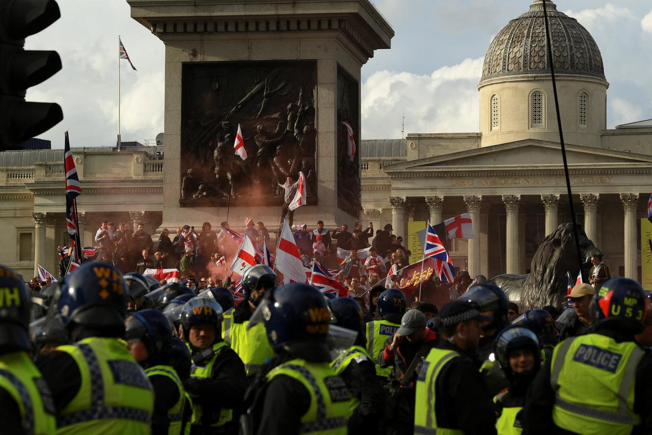 Protesters gather on the day of an anti-immigration rally organised by British anti-immigration activist Stephen Yaxley-Lennon, also known as Tommy Robinson in London