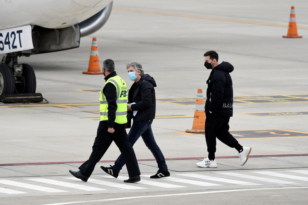 Argentine football star Lionel Messi boards a plane in Rosario