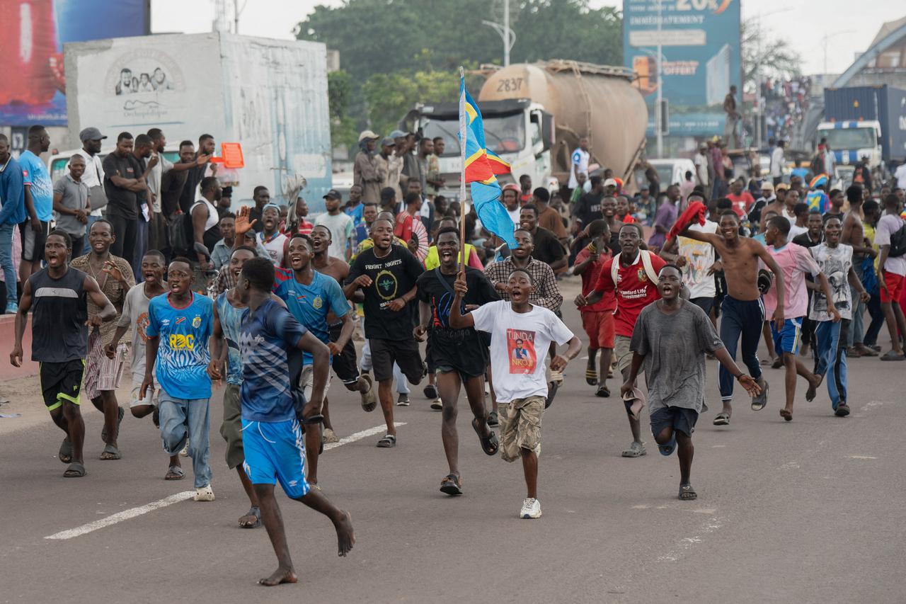 Fans celebrate as they welcome the Democratic Republic of Congo's national soccer team after qualifying for the 2026 World Cup, in Kinshasa