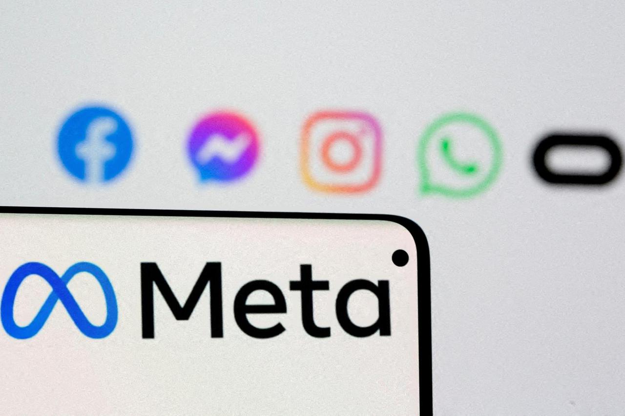 FILE PHOTO: Facebook's new rebrand logo Meta is seen on smartphone in this illustration picture