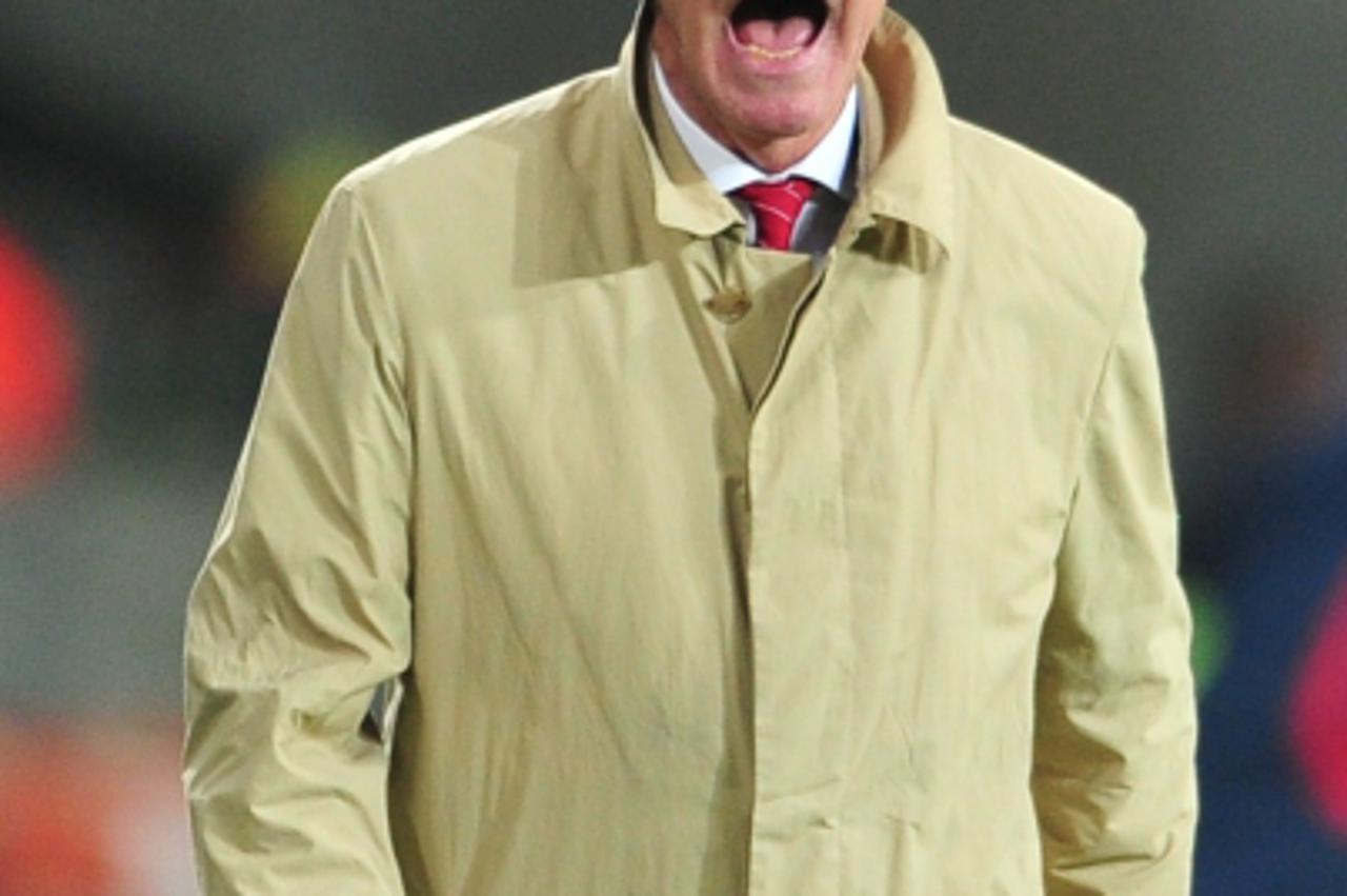 \'Switzerland\'s German Ottmar Hitzfeld reacts during the Group H first round 2010 World Cup football match Chile vs Switzerland on June 21, 2010 at Nelson Mandela Bay stadium in Port Elizabeth.  NO P