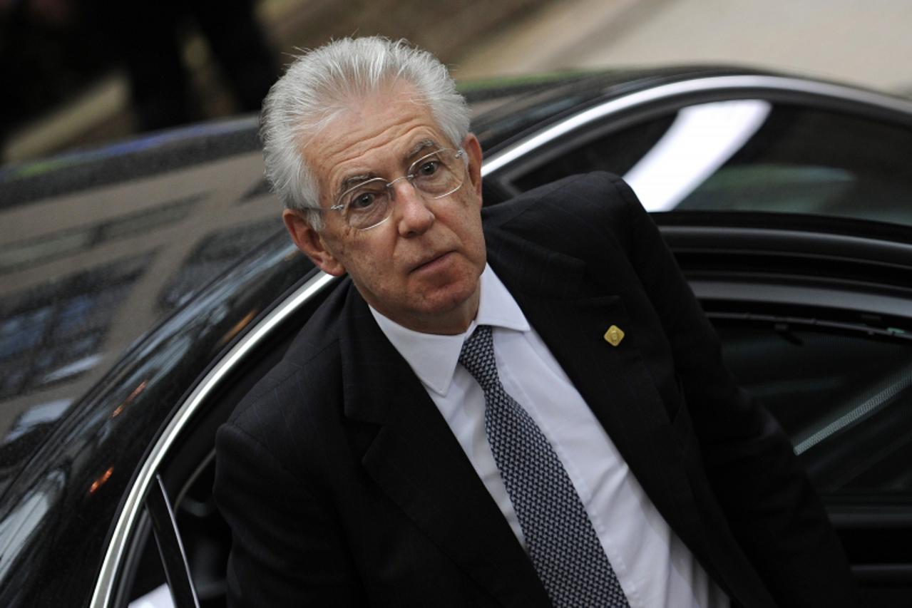 'Italian Prime Minister  Mario Monti arrives for a second day of the European Union leaders summit in Brussels on June 29, 2012.  Leaders from the 17 countries sharing the euro sealed a dramatic deal 