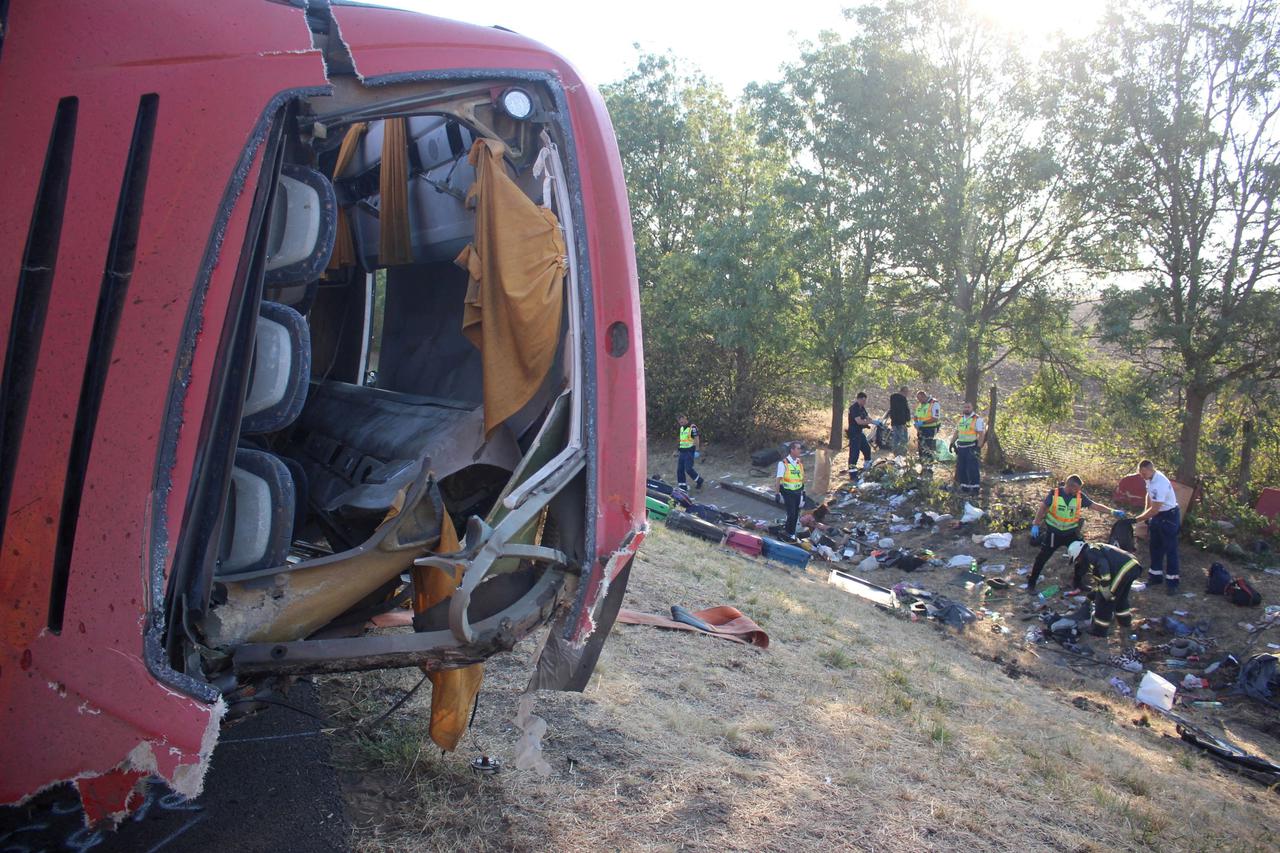 Firefighters work on the scene of a deadly accident near Mezokeresztes