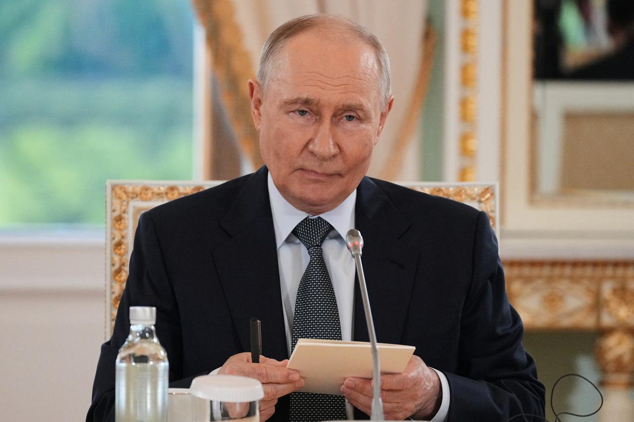 Russian President Vladimir Putin meets with representatives of international news agencies on the sidelines of the St. Petersburg International Economic Forum