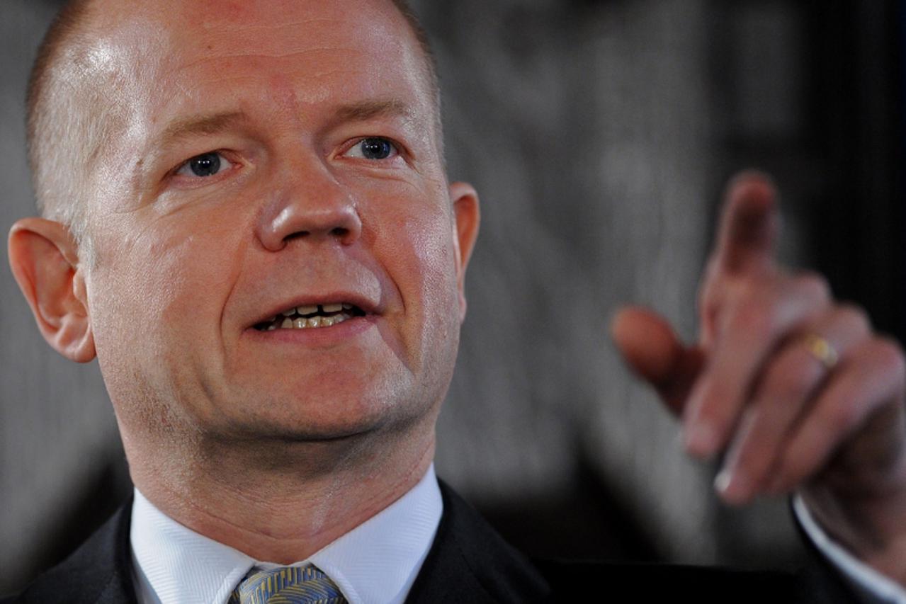 'British Foreign Secretary, William Hague, gestures as he delivers a speech entitled \'Britain\'s Values in a Networked World\' in London on September 15, 2010.    AFP PHOTO / BEN STANSALL / POOL'